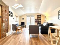 Living area with patio doors leading to the courtyard.