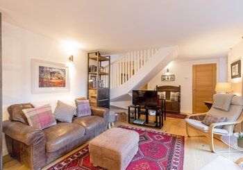 living room - Cosy sitting/dining area with sliding doors opening into the garden at Edinburgh self-catering apartment