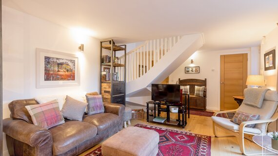 living room - Cosy sitting/dining area with sliding doors opening into the garden at Edinburgh self-catering apartment