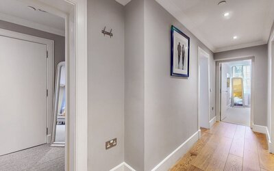 7-web-or-mls-242 West George Street Clyde_7 - Bright, clean hallway leading through the apartment