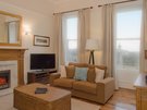 Lynedoch Place 7 - Family living room with decorative fireplace in Edinburgh holiday let