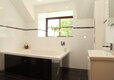 Well-lit Bathroom for Corporate Guests