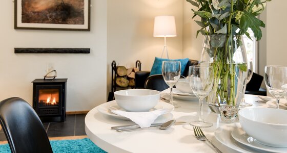 Cosy Dining Room in a Corporate Stay - Congregate in the dining room, where sumptuous seating and ambient décor create a welcoming atmosphere