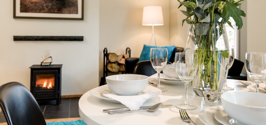 Cosy Dining Room in a Corporate Stay - Congregate in the dining room, where sumptuous seating and ambient décor create a welcoming atmosphere