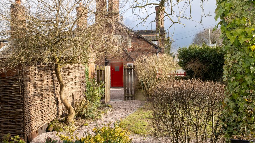large private grassed garden - this is a private large south
facing garden beyond the sunny paved area for dining there are trees hedges and flowers