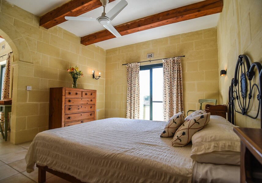 12. Main bedroom with ensuite and balcony and terrace overlooking pool area (3)