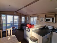 Lounge and Partial View of Kitchen and Dining Areas