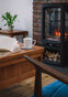 Coffe table in lounge in front of fireplace