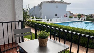 Private Terrace by the Pool - A terrace table and chair overlooking the garden and swimming pool. (© Goto Property Management)
