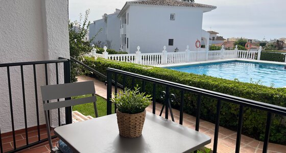 Private Terrace by the Pool - A terrace table and chair overlooking the garden and swimming pool. (© Goto Property Management)