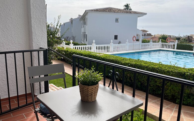 Private Terrace by the Pool - A terrace table and chair overlooking the garden and swimming pool. (© Goto Property Management)