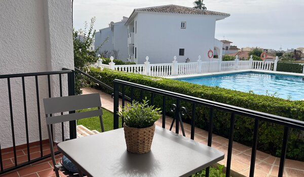 Private Terrace by the Pool - A terrace table and chair overlooking the garden and swimming pool. (© Goto Property Management)