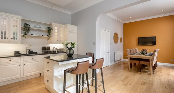 Open Plan Kitchen in a Holiday Home - A bright, airy, and beautifully integrated kitchen and dining space that perfectly blends classic elegance with a warm, welcoming vibe