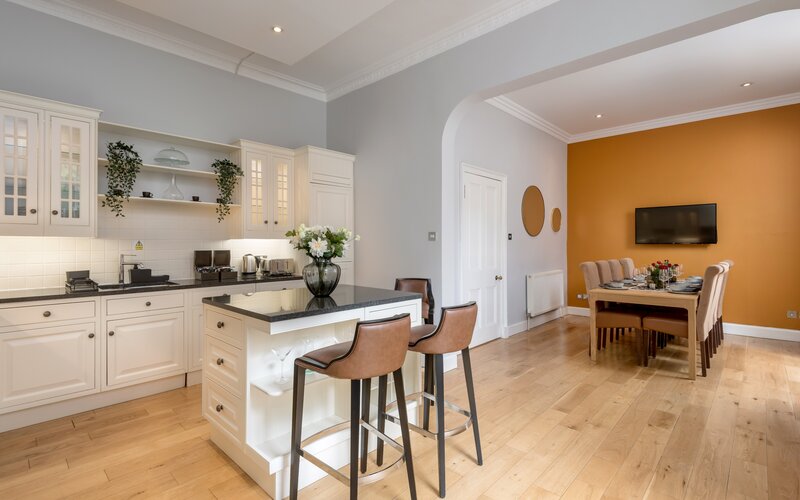 Open Plan Kitchen in a Holiday Home - A bright, airy, and beautifully integrated kitchen and dining space that perfectly blends classic elegance with a warm, welcoming vibe