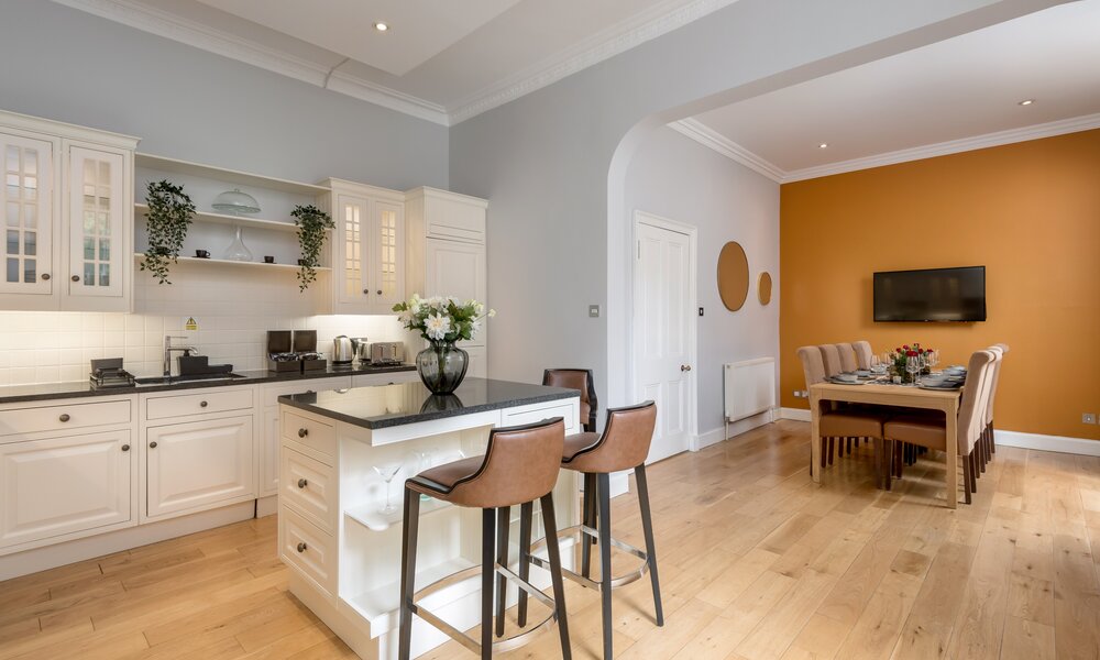 Open Plan Kitchen in a Holiday Home - A bright, airy, and beautifully integrated kitchen and dining space that perfectly blends classic elegance with a warm, welcoming vibe