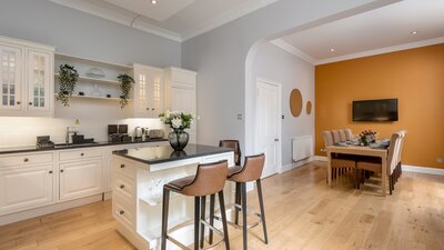 Open Plan Kitchen in a Holiday Home - A bright, airy, and beautifully integrated kitchen and dining space that perfectly blends classic elegance with a warm, welcoming vibe