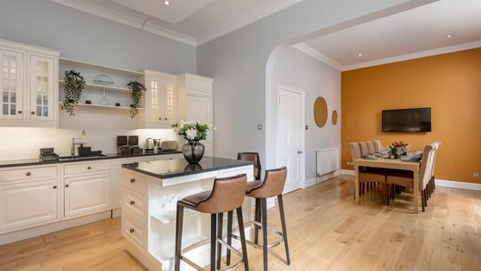 Open Plan Kitchen in a Holiday Home - A bright, airy, and beautifully integrated kitchen and dining space that perfectly blends classic elegance with a warm, welcoming vibe