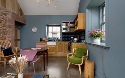 Kitchen in a Holiday Let in Nature - State-of-the-art kitchen equipped with high-spec appliances, sleek countertops and ample storage space