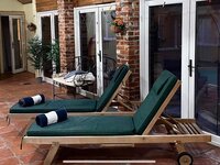 Sun loungers in the pool room.