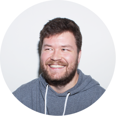 Colin Guthrie - Colin is a male with a warm smile, brown hair and a short beard, wearing a blue hooded jumper in a professional staff photo for Bookster Marketing Software.