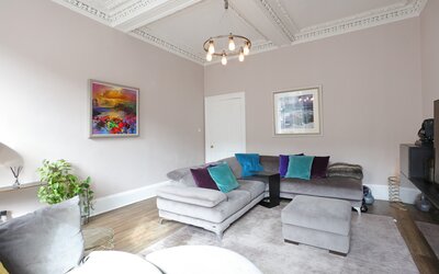 Living room - Family living room with comfortable seating and framed artwork