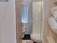 Walk in Wardrobe leading to Ensuite Bathroom