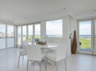 Clova Penthouse - dining area - Dining table seating 6 guests with spectacular views through full height windows