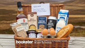 Welcome Pack example with fresh food products - A photo of a basket with jam, eggs, bread and other food.