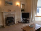 Spacious 2 bedroom holiday apartment in North Berwick just across from the beach - Comfortable sitting room with bay window (© Coast Properties)
