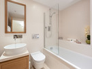Patriothall 6 - Bright family bathroom with bath and overhead shower