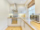 Gloucester Lane 12 - Contemporary, gleaming white kitchen within New Town Edinburgh holiday apartment.