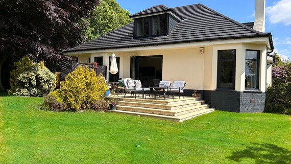 Longbank Luxury Lets - Stunning south facing private patio with comfy chairs, cushions, a gas BBQ and fire pit plus a table and chairs for al fresco dining.