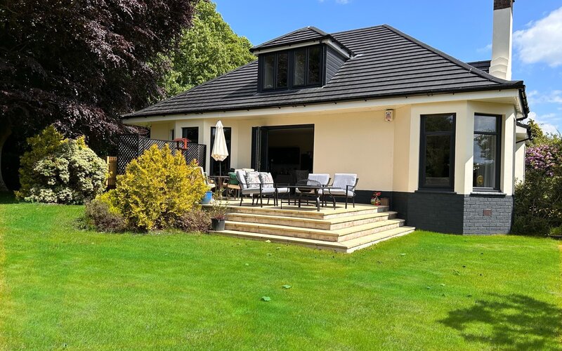 Longbank Luxury Lets - Stunning south facing private patio with comfy chairs, cushions, a gas BBQ and fire pit plus a table and chairs for al fresco dining.