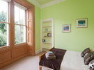 Double Bedroom 2 - The double bed faces large windows with a lovely view over gardens at the rear of the property.