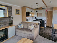 Lounge with TV and Fireplace, Kitchen and Dining Areas