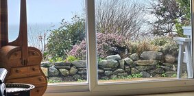 Patio doors leading to secure area outside.