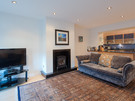 York Place Residence-24 - Spacious family living/kitchen area with wood burning stove