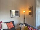 Living space in The Lothian Road Residence - Living room with two sofas and plenty of cushions.