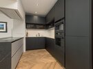 Kitchen - Contemporary kitchen with beautiful parquet flooring in Edinburgh holiday rental.