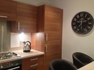 Kitchen equipped with bar stools and luxury clock!