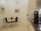Lynedoch Place 9 - Contemporary family kitchen with dining table and framed artwork