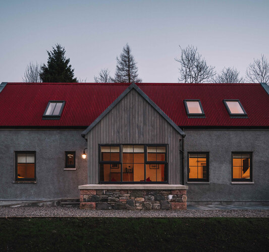 AnD-outside-dusk-low-res - A view of the cottage from outside