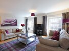 1V7A9416 - Elegant interior design, featuring tartan rug and soft furnishings in Edinburgh holiday home.