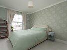 King Bedroom with Firth of Forth Views - Wake up to natural light and views towards the Firth of Forth in the beautifully presented king bedroom, complete with stylish décor, bedside tables and bespoke shelving.