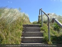 Direct beach access via concrete steps