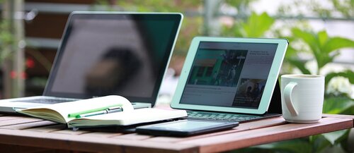 Image of a laptop and a cup of coffee