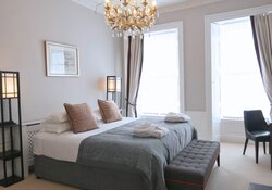 Elegant Primary Bedroom with Chandelier – Edinburgh