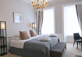 Elegant Primary Bedroom with Chandelier – Edinburgh