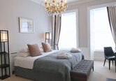 Elegant Primary Bedroom with Chandelier – Edinburgh