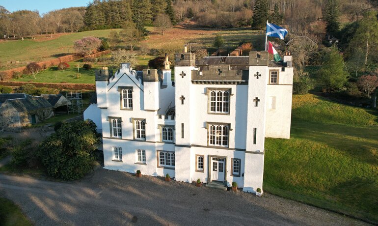 Bolfracks House & Gardens in Rural Scotland - Grand white building amongst green fields and forest